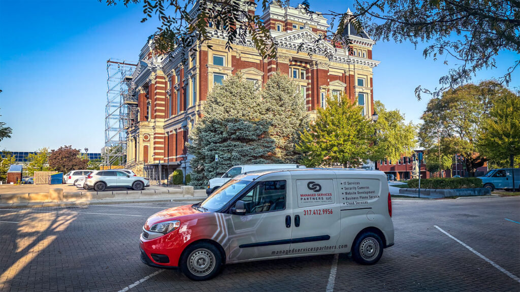 A Managed Services Partners service van parked outside the courthouse in Franklin, Indiana.